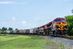 KCS 5023 leads an empty grain train around the big bend in Wharton